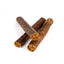 Three dog chew treats on a white background