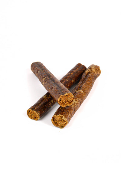 Three dog chew treats on a white background